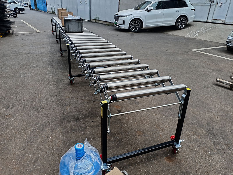 动力伸缩辊筒输送机-线上放纸箱周转箱货物.jpg 动力伸缩辊筒输送机-线上放纸箱周转箱货物.jpg